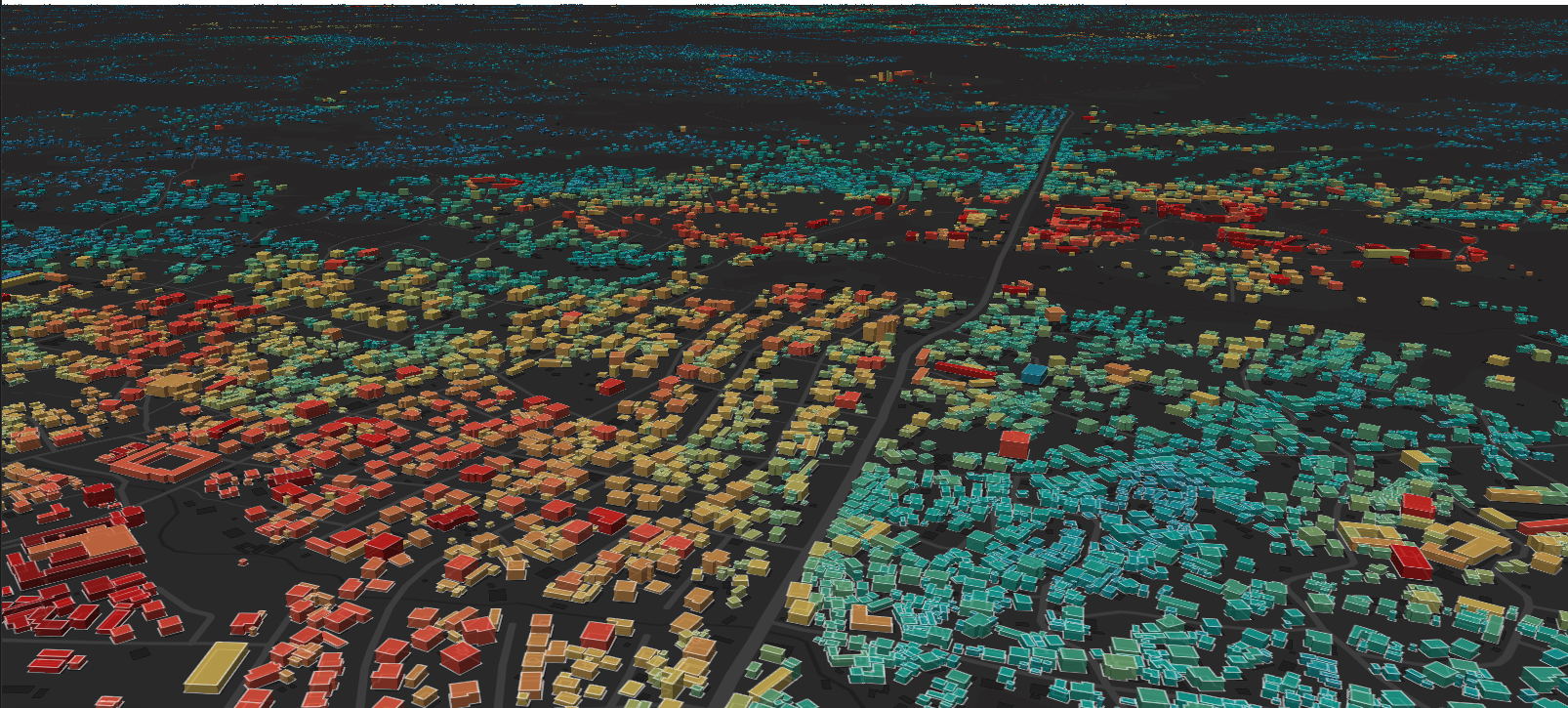 A rendering of buildings with a heatmap overlaid on top of them that shows electricity use in different buildings. The cast of the image is black and the buildings appear in a range of colors from blue to red.